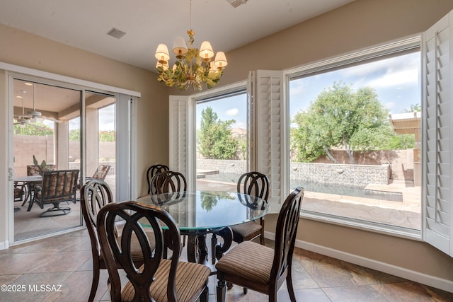 36330 S Desert Sun Dr, Tucson, AZ 85739 - dining space with a chandelier, plenty of natural light, and baseboards