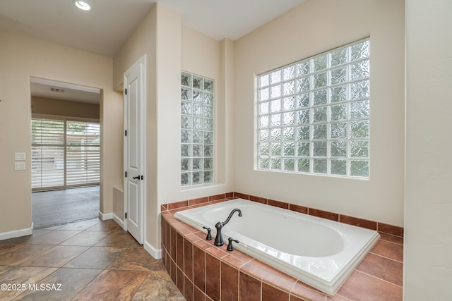 36330 S Desert Sun Dr, Tucson, AZ 85739 - bathroom featuring a bath, baseboards, and recessed lighting