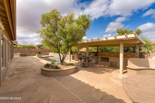 36330 S Desert Sun Dr, Tucson, AZ 85739 - view of patio with an outdoor kitchen and a fenced backyard