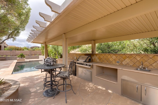 36330 S Desert Sun Dr, Tucson, AZ 85739 - view of patio / terrace with exterior kitchen, a fenced backyard, a sink, and grilling area