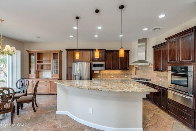 36330 S Desert Sun Dr, Tucson, AZ 85739 - kitchen featuring appliances with stainless steel finishes, wall chimney exhaust hood, a warming drawer, open shelves, and tasteful backsplash