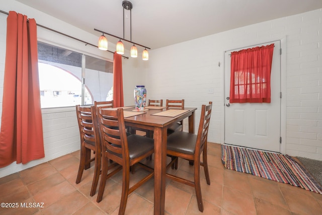 dining space with light tile patterned flooring