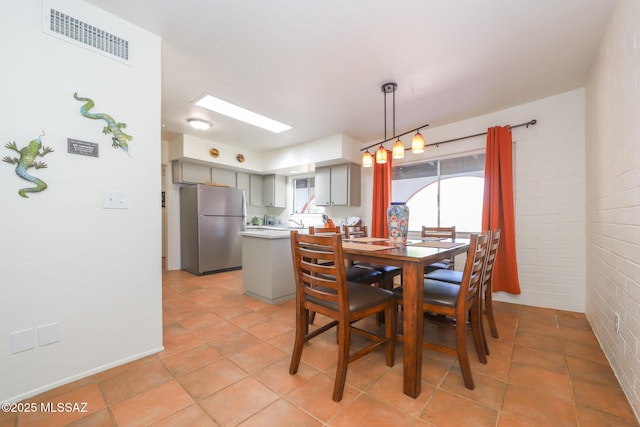 dining area with visible vents and light tile patterned floors