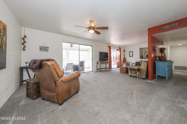 carpeted living room with a ceiling fan and visible vents