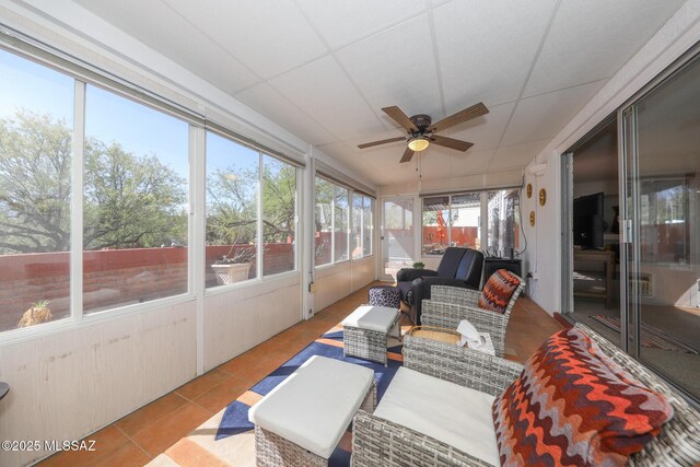 sunroom with an outdoor hangout area and ceiling fan