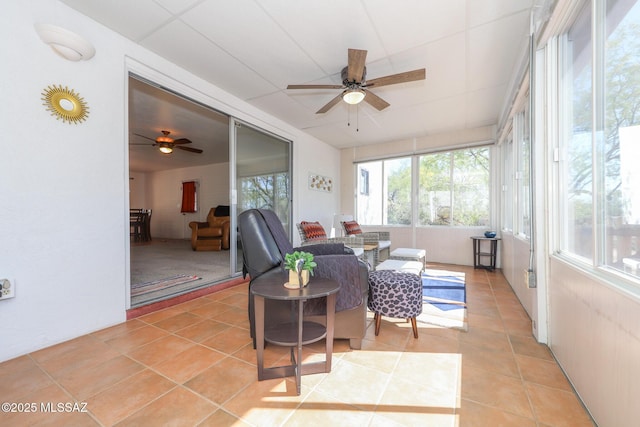 sunroom featuring plenty of natural light and tile patterned flooring