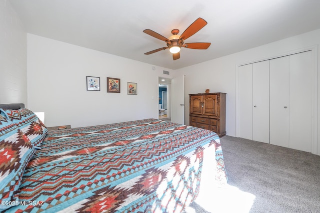 bedroom featuring carpet floors, a ceiling fan, visible vents, and a closet