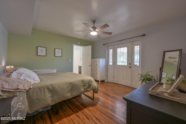 bedroom with a ceiling fan and wood finished floors