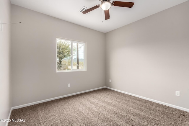 9008 W Bruce St, Tucson, AZ 85735 - spare room featuring baseboards, a ceiling fan, visible vents, and carpet