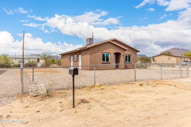 9008 W Bruce St, Tucson, AZ 85735 - view of side of home featuring fence, a tiled roof, a chimney, and stucco siding