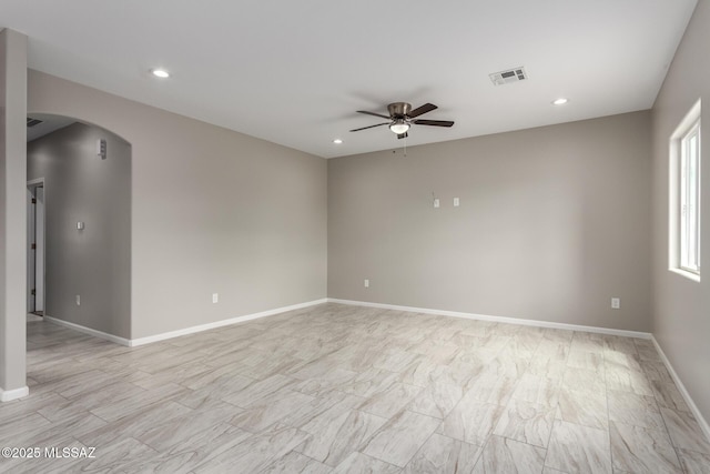 9008 W Bruce St, Tucson, AZ 85735 - spare room featuring arched walkways, a ceiling fan, visible vents, and recessed lighting