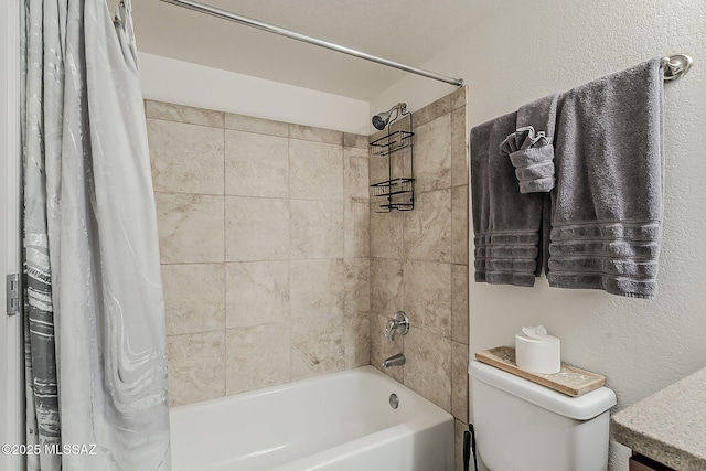 full bathroom featuring shower / bath combination with curtain and toilet