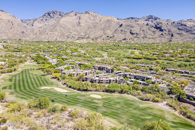 birds eye view of property featuring view of golf course and a mountain view