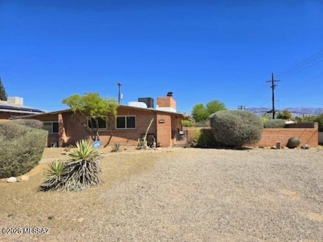 4743 E Scarlett St, Tucson, AZ 85711 - back of house featuring a chimney