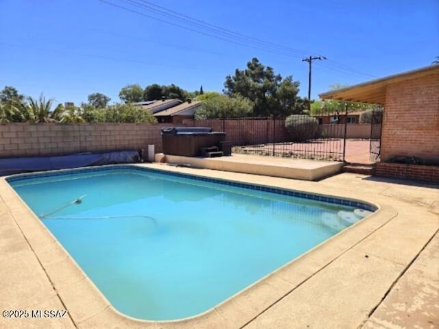 4743 E Scarlett St, Tucson, AZ 85711 - view of swimming pool with a patio, a fenced in pool, a fenced backyard, and a hot tub