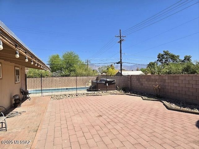 4743 E Scarlett St, Tucson, AZ 85711 - view of patio / terrace with a fenced in pool and a fenced backyard