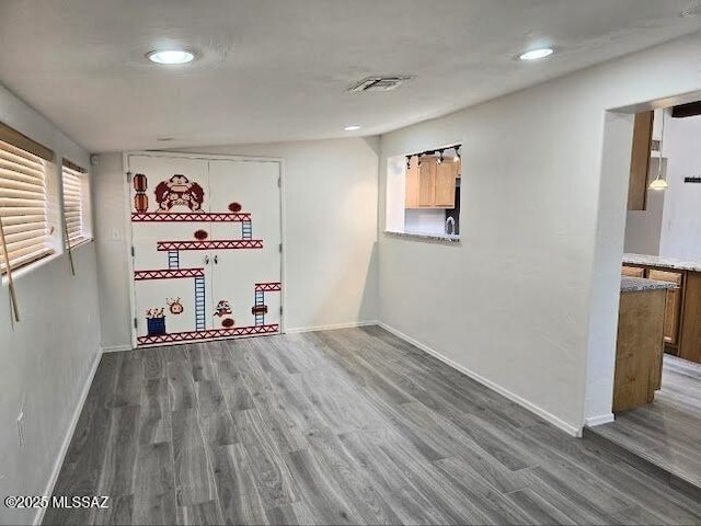 4743 E Scarlett St, Tucson, AZ 85711 - basement featuring baseboards, visible vents, wood finished floors, and recessed lighting