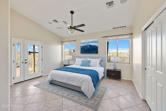 bedroom with light tile patterned floors, visible vents, access to exterior, and lofted ceiling