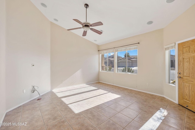 unfurnished room featuring light tile patterned floors, baseboards, a ceiling fan, and lofted ceiling