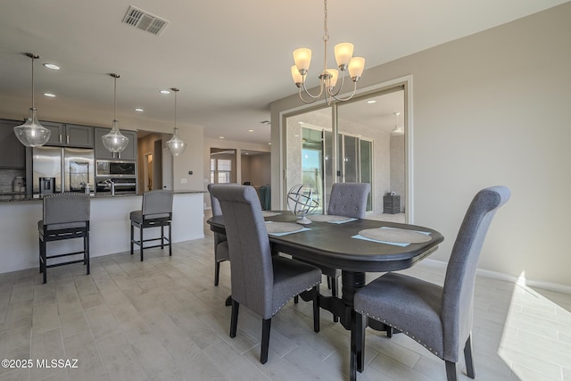 5369 S Sierra Prieta Trl, Tucson, AZ 85747 - dining room with recessed lighting, light wood-style flooring, visible vents, and an inviting chandelier
