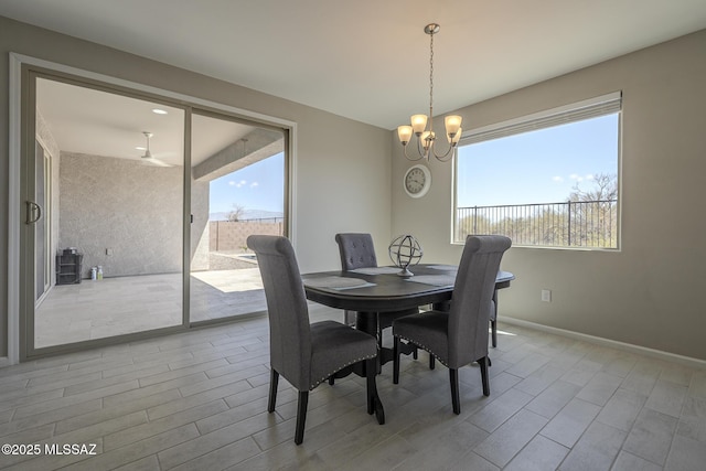 5369 S Sierra Prieta Trl, Tucson, AZ 85747 - dining space featuring an inviting chandelier, wood finished floors, and plenty of natural light