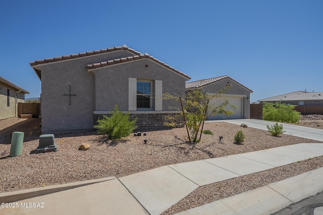 5369 S Sierra Prieta Trl, Tucson, AZ 85747 - mediterranean / spanish-style home with fence, concrete driveway, a tiled roof, stucco siding, and a garage