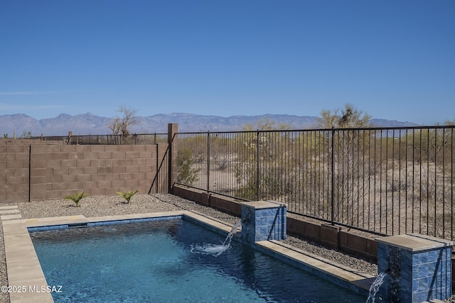 5369 S Sierra Prieta Trl, Tucson, AZ 85747 - view of swimming pool with a fenced backyard, a mountain view, and a fenced in pool