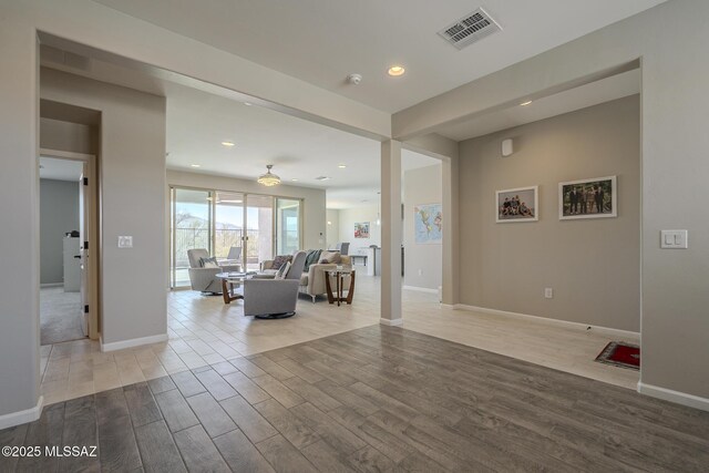 5369 S Sierra Prieta Trl, Tucson, AZ 85747 - living area featuring baseboards, visible vents, and wood finished floors