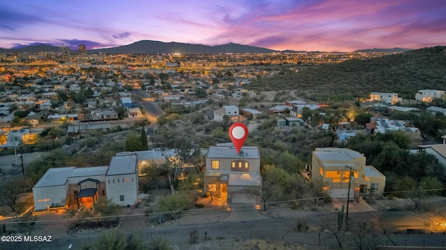 aerial view at dusk with a mountain view