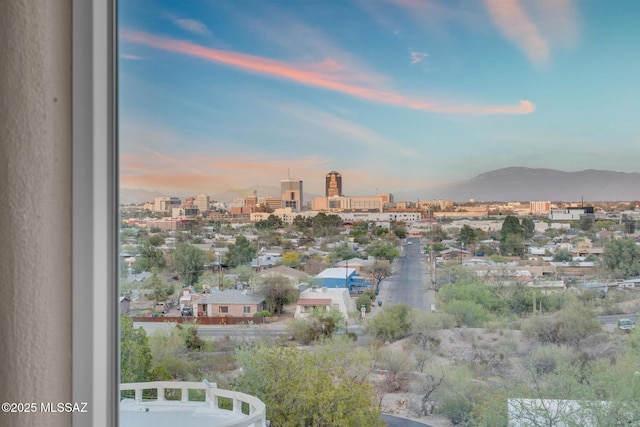 exterior space with a view of city and a mountain view