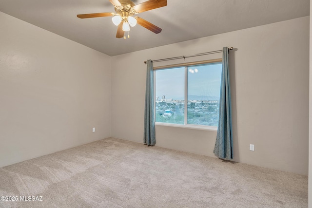 carpeted empty room with ceiling fan