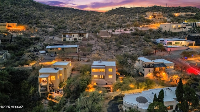 birds eye view of property with a mountain view