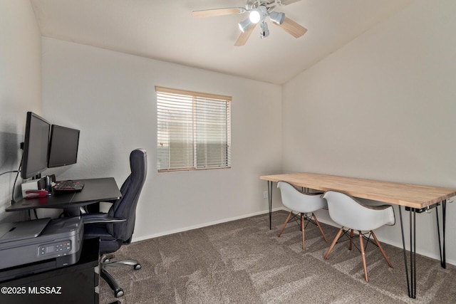 carpeted home office with a ceiling fan, baseboards, and lofted ceiling