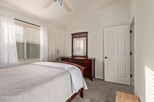 bedroom with carpet floors, a ceiling fan, and vaulted ceiling