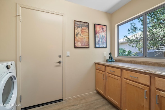 37561 S Desert Sun Dr, Saddlebrooke, AZ 85739 - laundry area with cabinet space, light wood-style floors, washer / clothes dryer, and baseboards