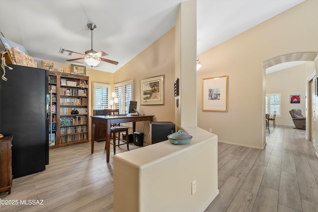 37561 S Desert Sun Dr, Saddlebrooke, AZ 85739 - office area featuring lofted ceiling, a wealth of natural light, ceiling fan, and arched walkways