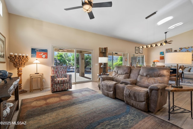 37561 S Desert Sun Dr, Saddlebrooke, AZ 85739 - living room with wood finished floors, ceiling fan, and vaulted ceiling