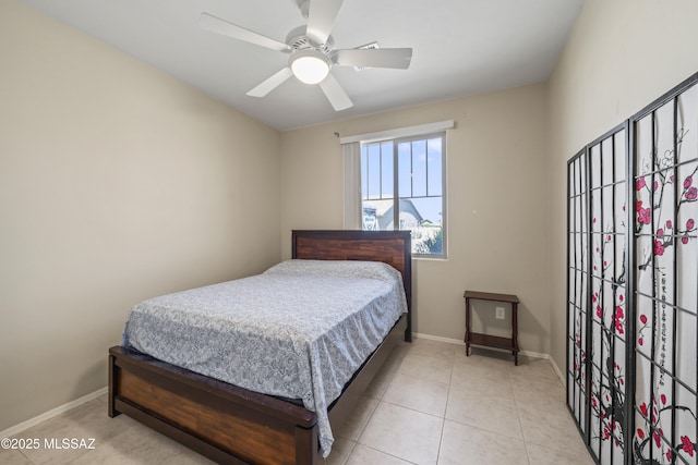 bedroom featuring baseboards and ceiling fan
