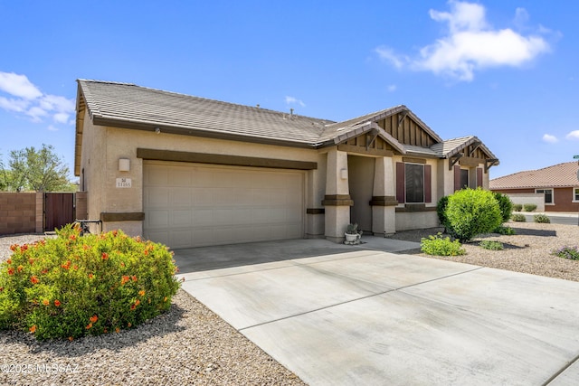 single story home featuring a tile roof, concrete driveway, a garage, and stucco siding