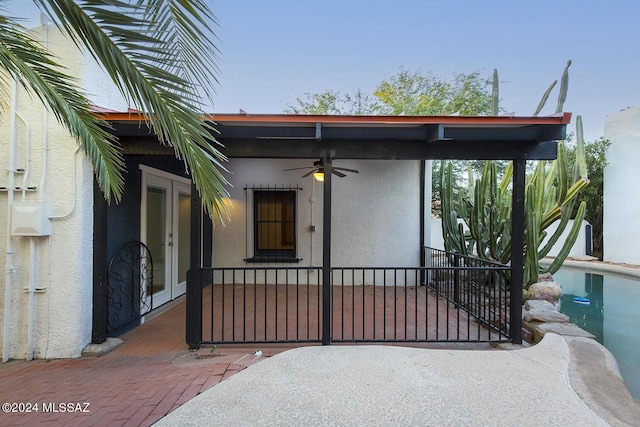 exterior space featuring a ceiling fan and french doors