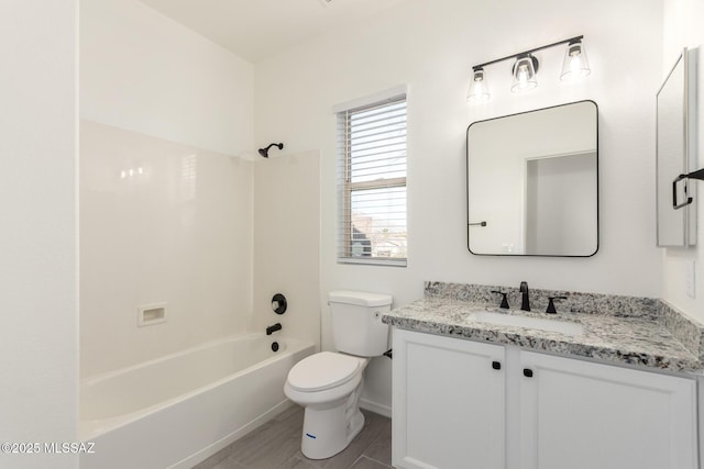 bathroom with baseboards, shower / bathing tub combination, toilet, and vanity