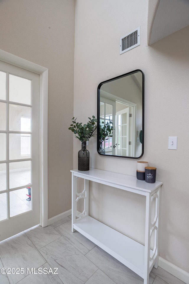 room details featuring baseboards and visible vents