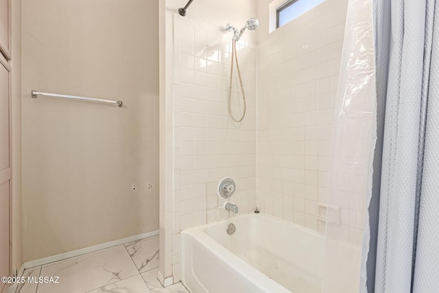 bathroom with baseboards, shower / tub combo with curtain, and marble finish floor