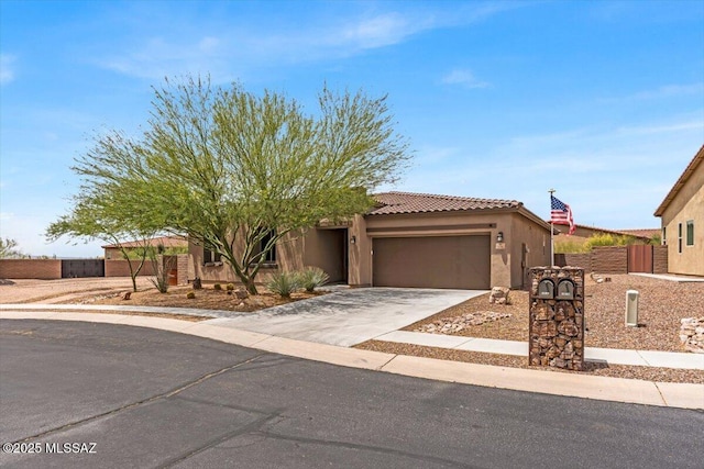 3156 S Three D Ct, Tucson, AZ 85713 - view of front of property featuring an attached garage, concrete driveway, stucco siding, a tile roof, and fence
