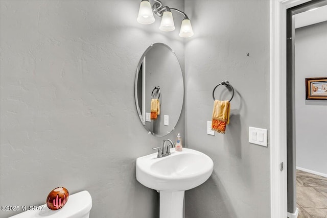 3156 S Three D Ct, Tucson, AZ 85713 - half bathroom with toilet and baseboards