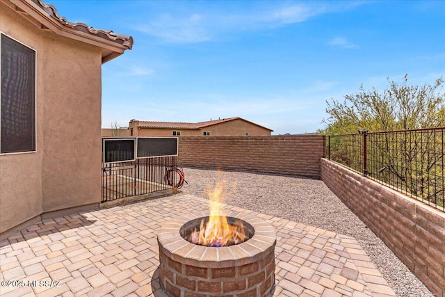 3156 S Three D Ct, Tucson, AZ 85713 - view of patio with a fire pit and a fenced backyard