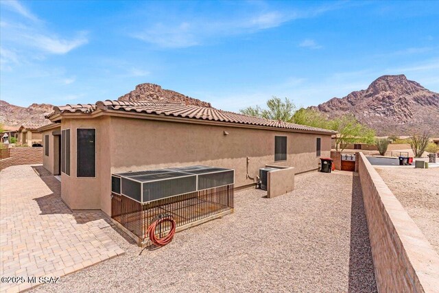 3156 S Three D Ct, Tucson, AZ 85713 - rear view of property featuring a mountain view, stucco siding, and a tile roof