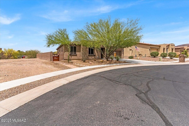 3156 S Three D Ct, Tucson, AZ 85713 - view of front of property with a garage, driveway, and stucco siding