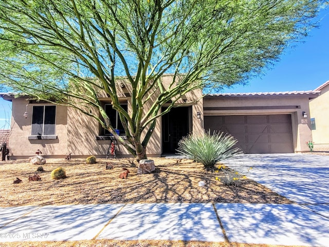 3156 S Three D Ct, Tucson, AZ 85713 - view of front facade featuring stucco siding, a garage, driveway, and a tiled roof