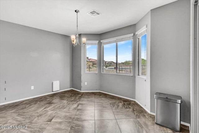3156 S Three D Ct, Tucson, AZ 85713 - unfurnished dining area with a chandelier and baseboards